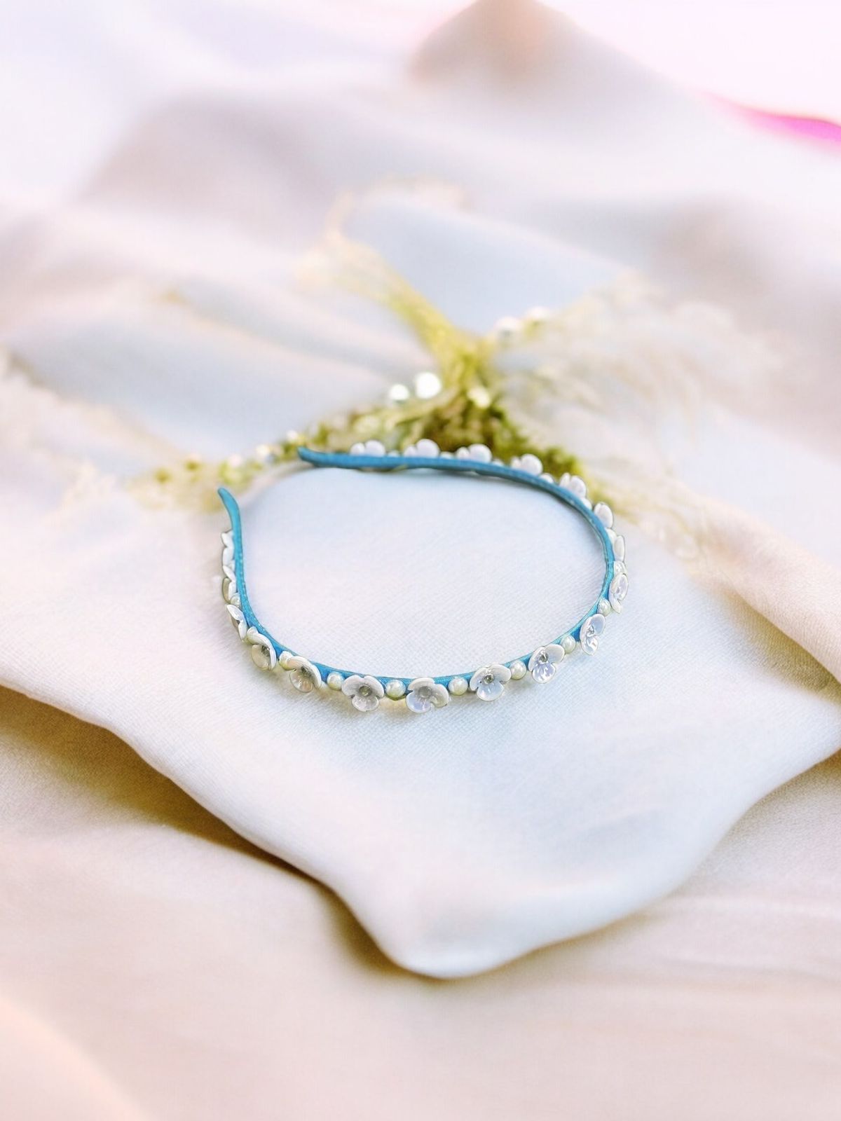 Embrace the Magic with Our Sky Blue Pearl & Flower Hairband