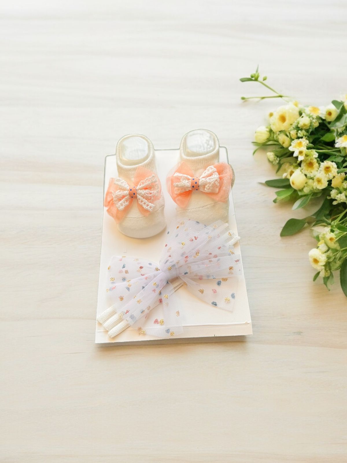 Adorable Comfort: Baby Booties and Hairband Set